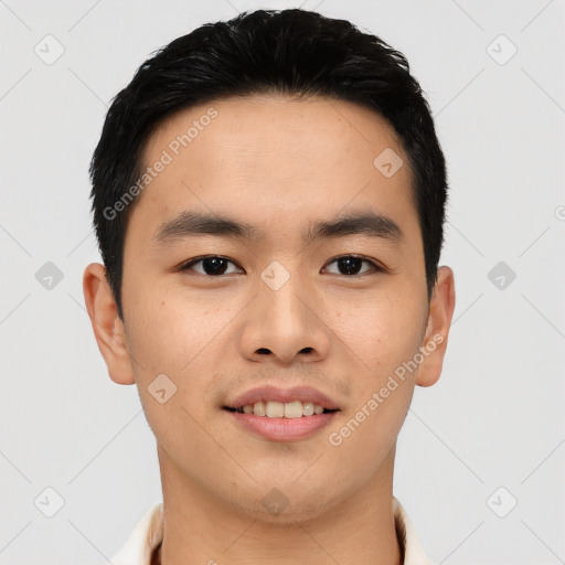 Joyful asian young-adult male with short  brown hair and brown eyes