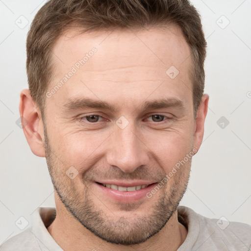 Joyful white adult male with short  brown hair and grey eyes