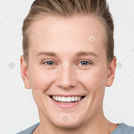 Joyful white young-adult female with short  brown hair and grey eyes