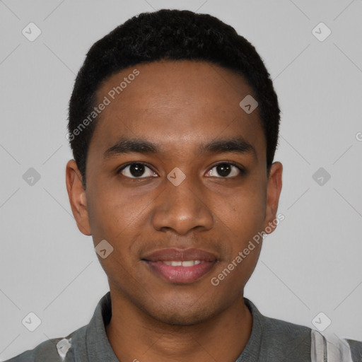 Joyful black young-adult male with short  black hair and brown eyes