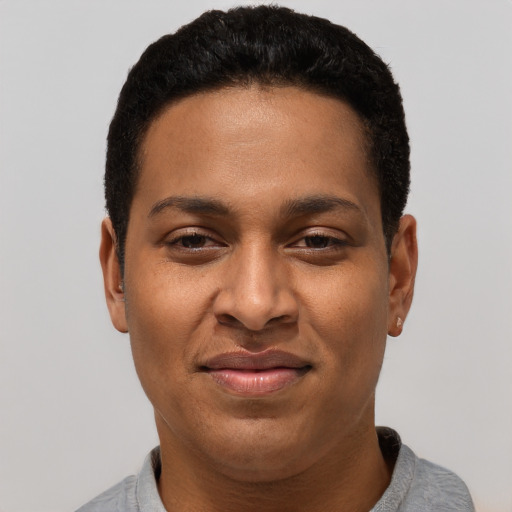 Joyful black young-adult male with short  black hair and brown eyes
