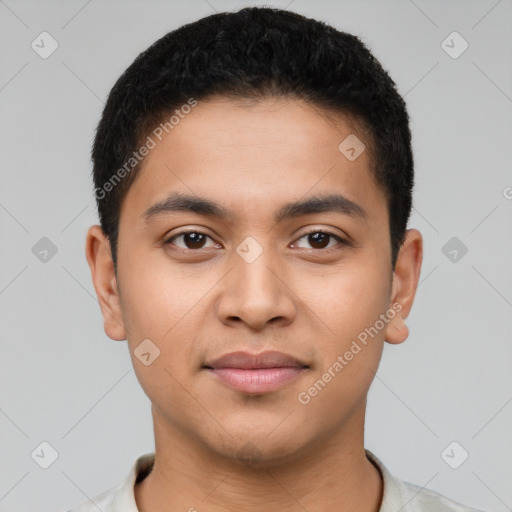 Joyful latino young-adult male with short  brown hair and brown eyes