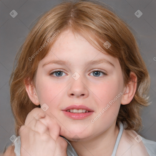 Joyful white child female with medium  brown hair and blue eyes