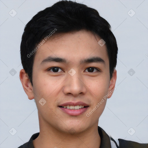 Joyful white young-adult male with short  black hair and brown eyes