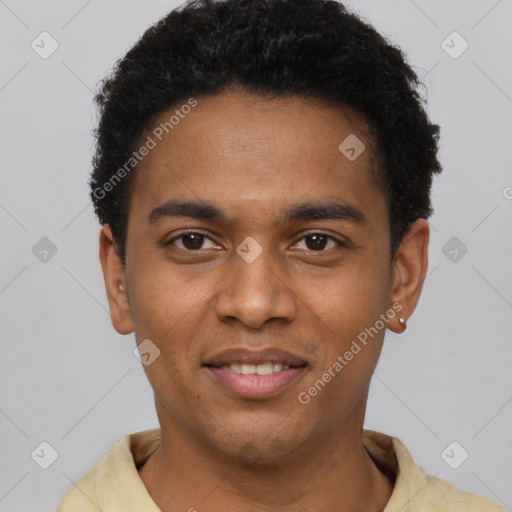 Joyful black young-adult male with short  brown hair and brown eyes