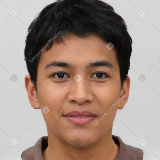 Joyful asian young-adult male with short  brown hair and brown eyes