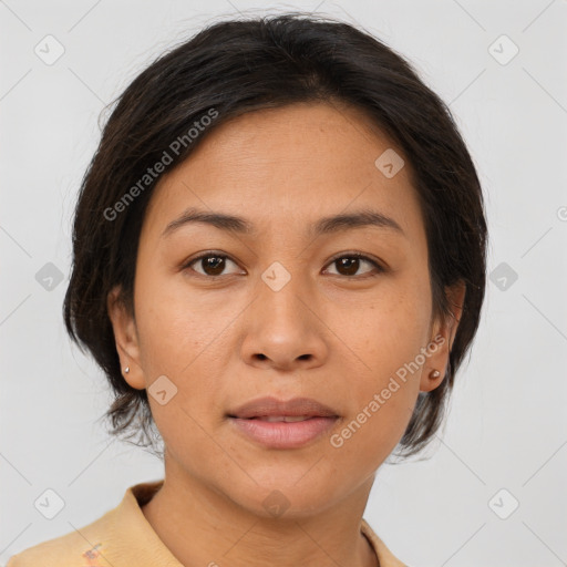 Joyful asian young-adult female with medium  brown hair and brown eyes