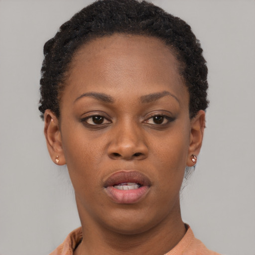 Neutral black young-adult female with short  brown hair and brown eyes