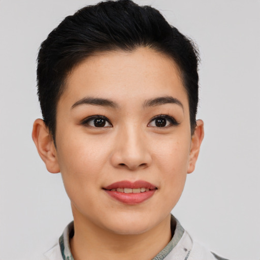 Joyful asian young-adult female with short  black hair and brown eyes