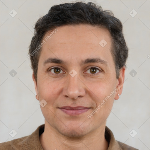 Joyful white adult male with short  brown hair and brown eyes