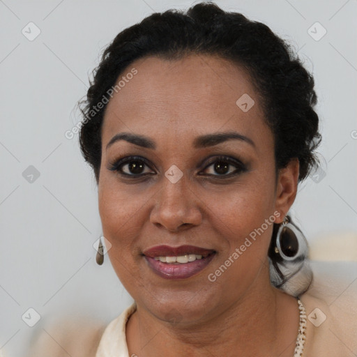 Joyful black adult female with short  brown hair and brown eyes