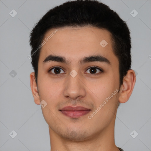 Joyful white young-adult male with short  black hair and brown eyes