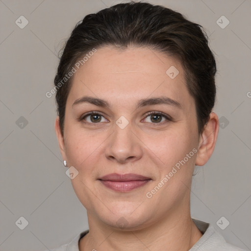 Joyful white young-adult female with short  brown hair and grey eyes