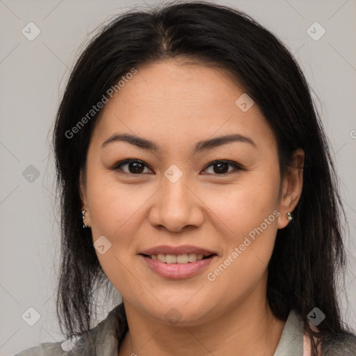 Joyful asian young-adult female with medium  brown hair and brown eyes