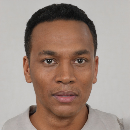 Neutral black young-adult male with short  black hair and brown eyes