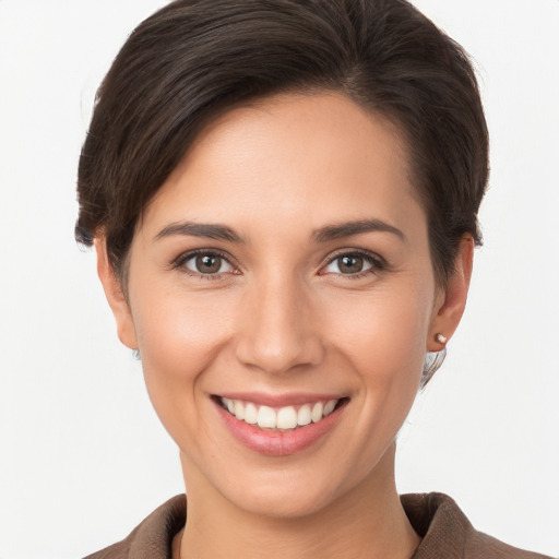 Joyful white young-adult female with short  brown hair and brown eyes