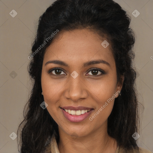 Joyful black young-adult female with long  brown hair and brown eyes