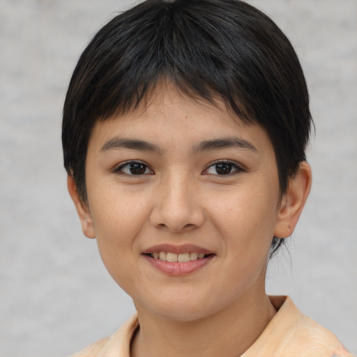 Joyful asian young-adult female with short  brown hair and brown eyes