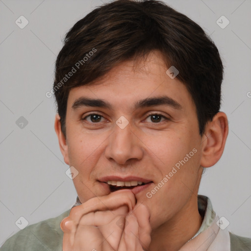 Joyful white adult male with short  brown hair and brown eyes