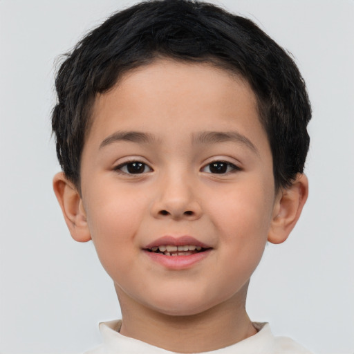 Joyful white child male with short  brown hair and brown eyes