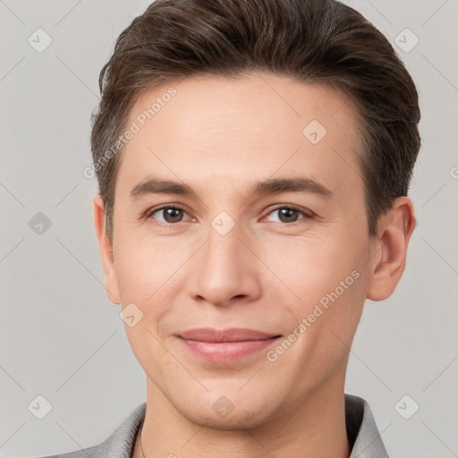 Joyful white young-adult male with short  brown hair and brown eyes