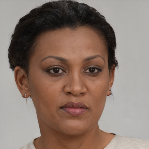 Neutral black adult female with short  brown hair and brown eyes