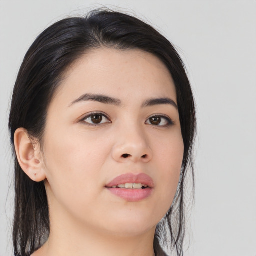 Joyful asian young-adult female with long  black hair and brown eyes