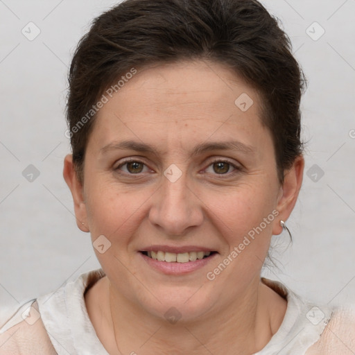 Joyful white adult female with short  brown hair and brown eyes