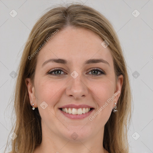 Joyful white young-adult female with long  brown hair and grey eyes