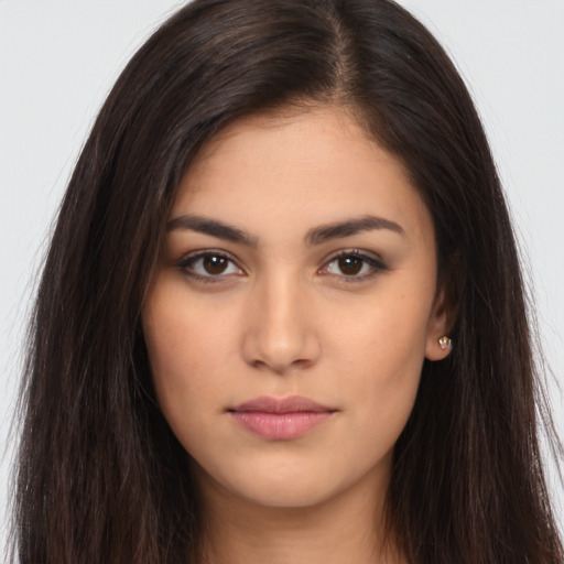 Neutral latino young-adult female with long  brown hair and brown eyes