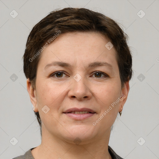 Joyful white adult female with short  brown hair and grey eyes