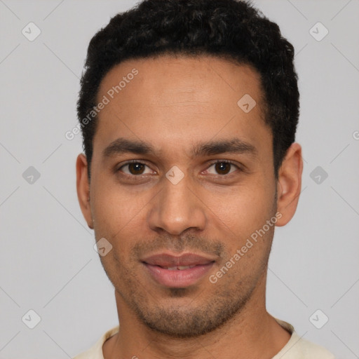 Joyful latino young-adult male with short  black hair and brown eyes