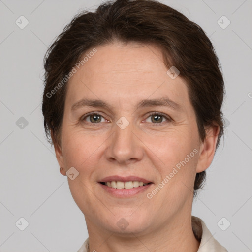 Joyful white adult female with short  brown hair and brown eyes