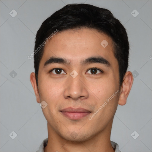 Joyful latino young-adult male with short  brown hair and brown eyes