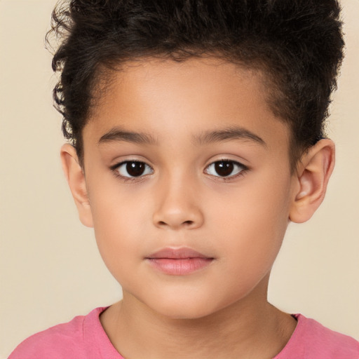 Joyful white child male with short  brown hair and brown eyes