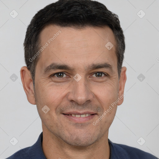 Joyful white adult male with short  brown hair and brown eyes