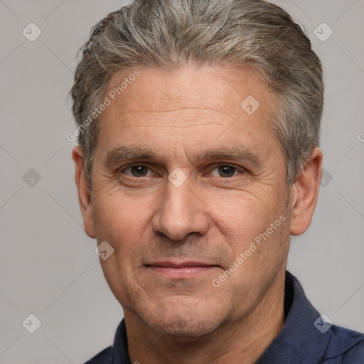 Joyful white middle-aged male with short  brown hair and brown eyes