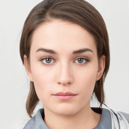 Neutral white young-adult female with medium  brown hair and grey eyes