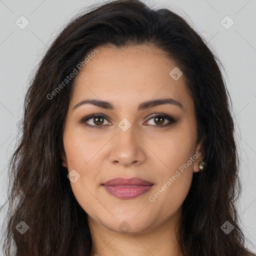 Joyful latino young-adult female with long  brown hair and brown eyes