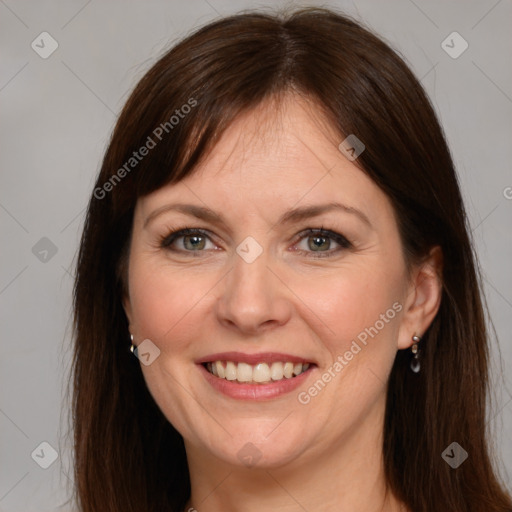 Joyful white adult female with medium  brown hair and brown eyes