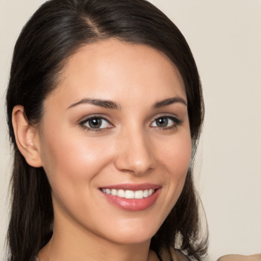 Joyful white young-adult female with medium  brown hair and brown eyes