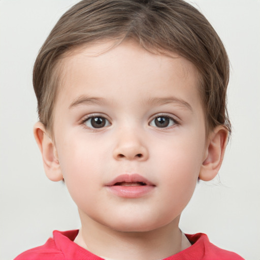 Joyful white child male with short  brown hair and brown eyes