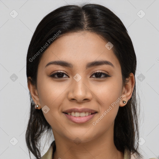 Joyful latino young-adult female with long  brown hair and brown eyes