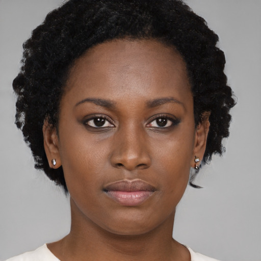 Neutral black young-adult female with short  brown hair and brown eyes