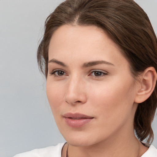 Neutral white young-adult female with medium  brown hair and brown eyes