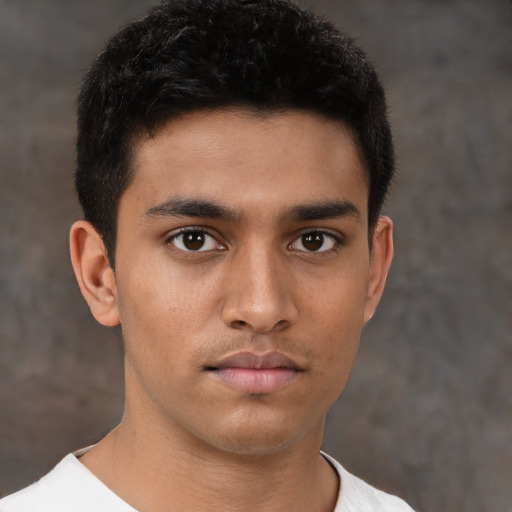 Neutral latino young-adult male with short  brown hair and brown eyes