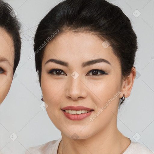 Joyful asian young-adult female with medium  brown hair and brown eyes