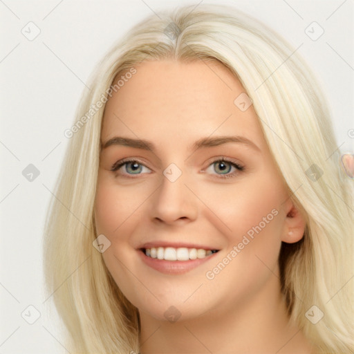 Joyful white young-adult female with long  brown hair and blue eyes