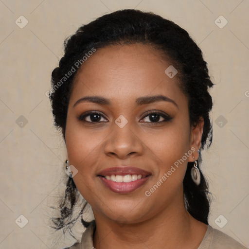 Joyful black young-adult female with long  black hair and brown eyes