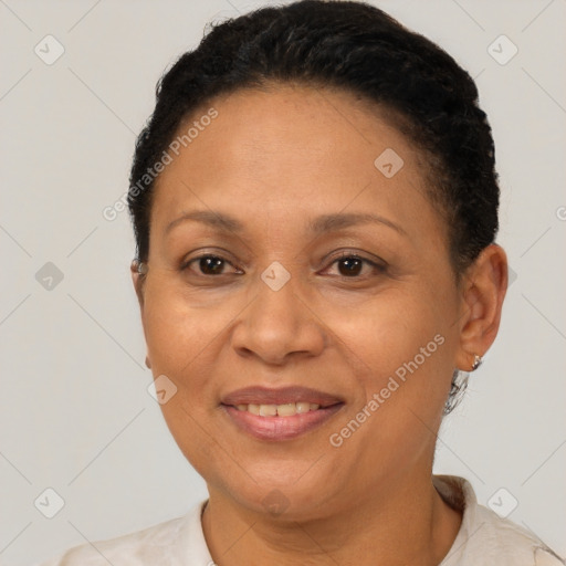 Joyful latino adult female with short  brown hair and brown eyes